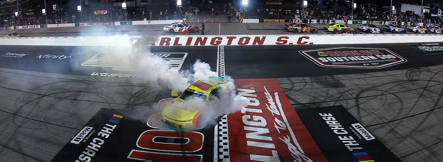 Sheldon Creed, driver of the #00 Ollie's Chevrolet, celebrates with a burnout as fireworks erupt after winning the NASCAR O'Reilly Auto Parts Series Fleetio 200 at Darlington Raceway on September 05, 2026 in Darlington, South Carolina.